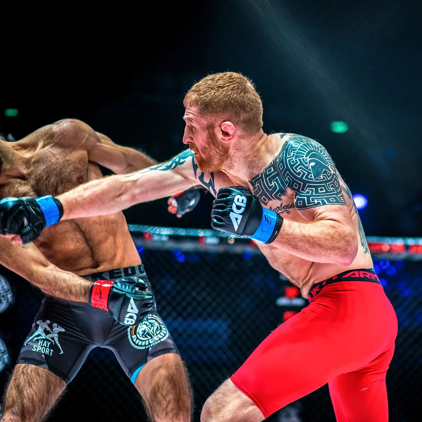 Andrew Fisher landing a punch during an MMA contest