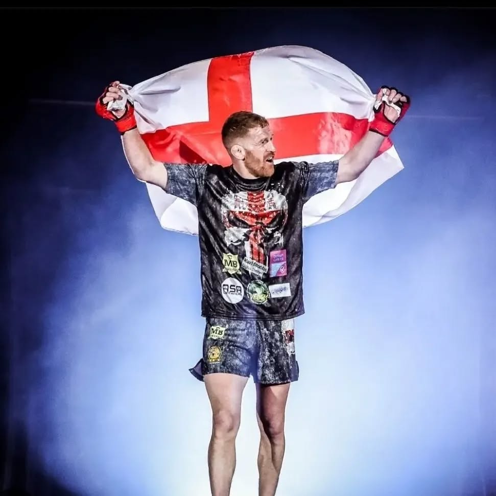 Andrew Fisher celebrating with the England flag