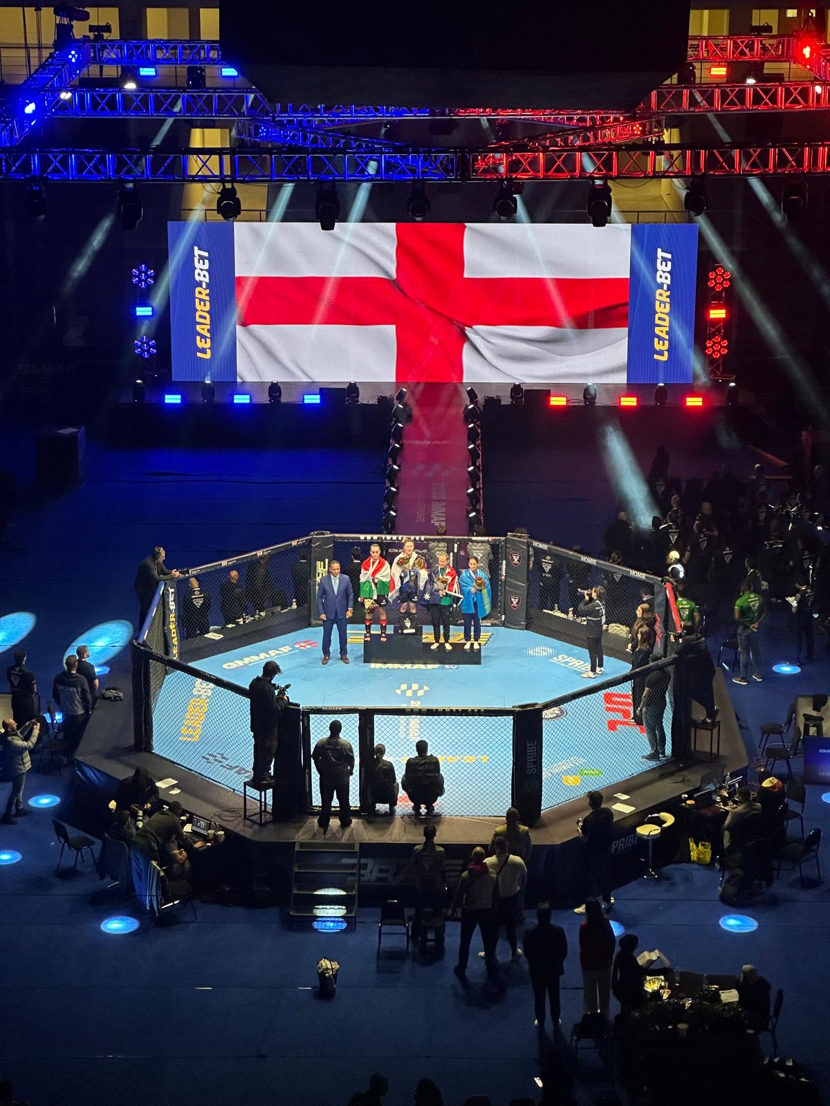 Wide view of the IMMAF arena, cage and event production