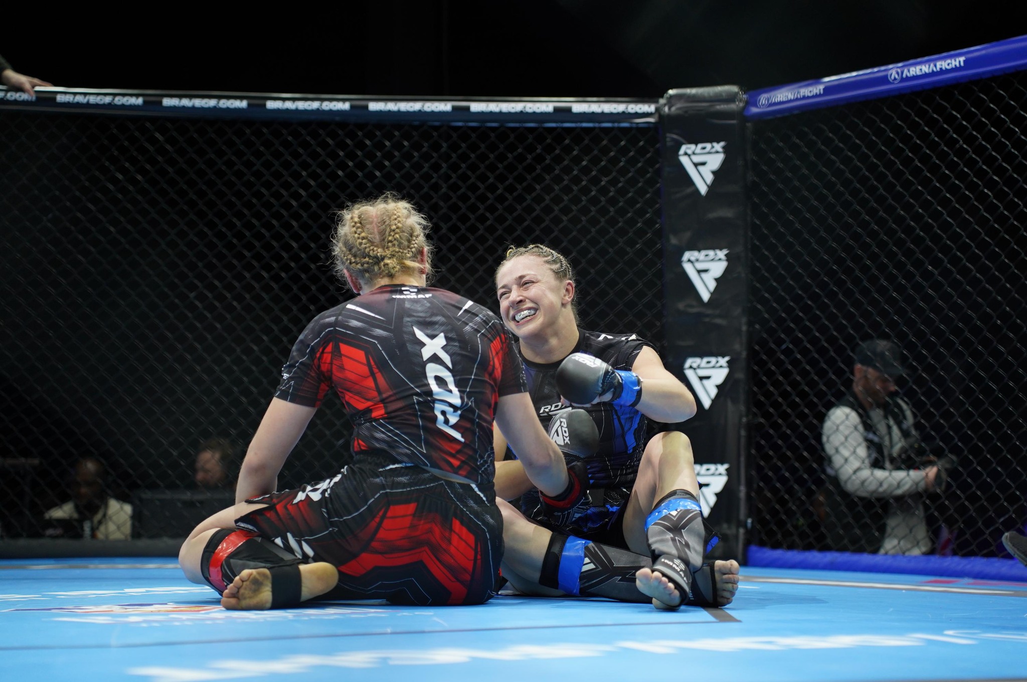 Katrina Fisher and her opponent smiling together after their fight