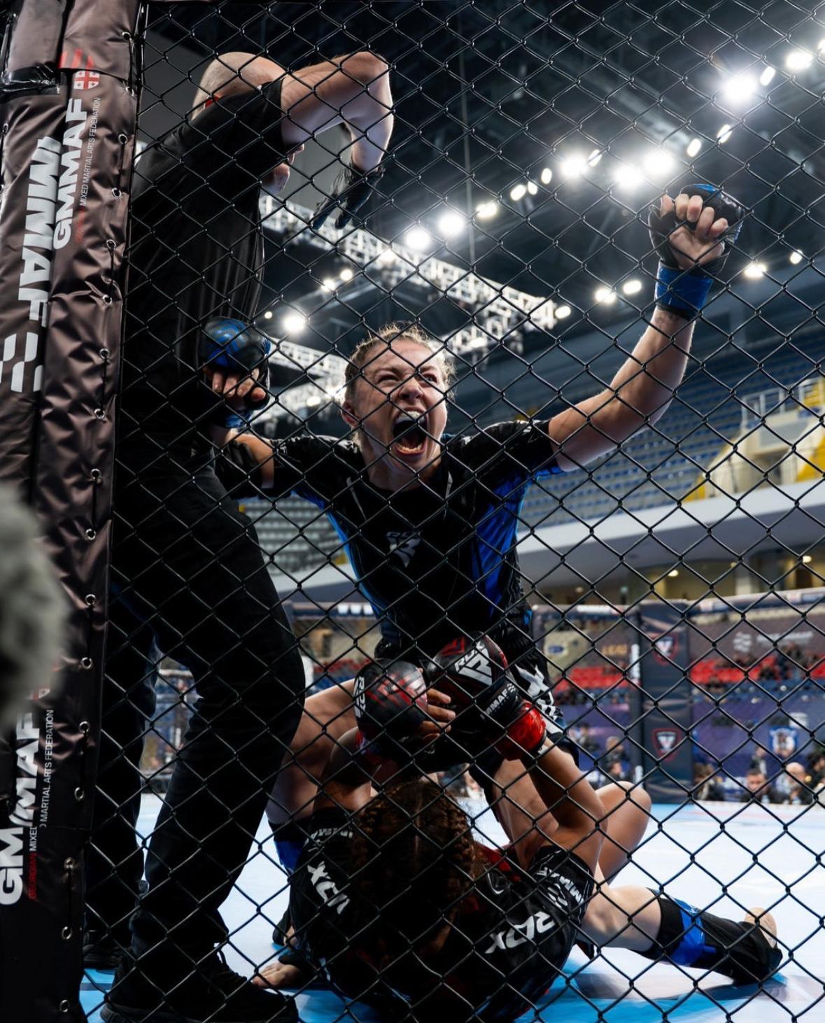 Katrina Fisher celebrating after an IMMAF victory